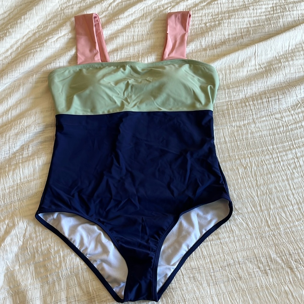 Brand new, never worn color block one piece swimsuit